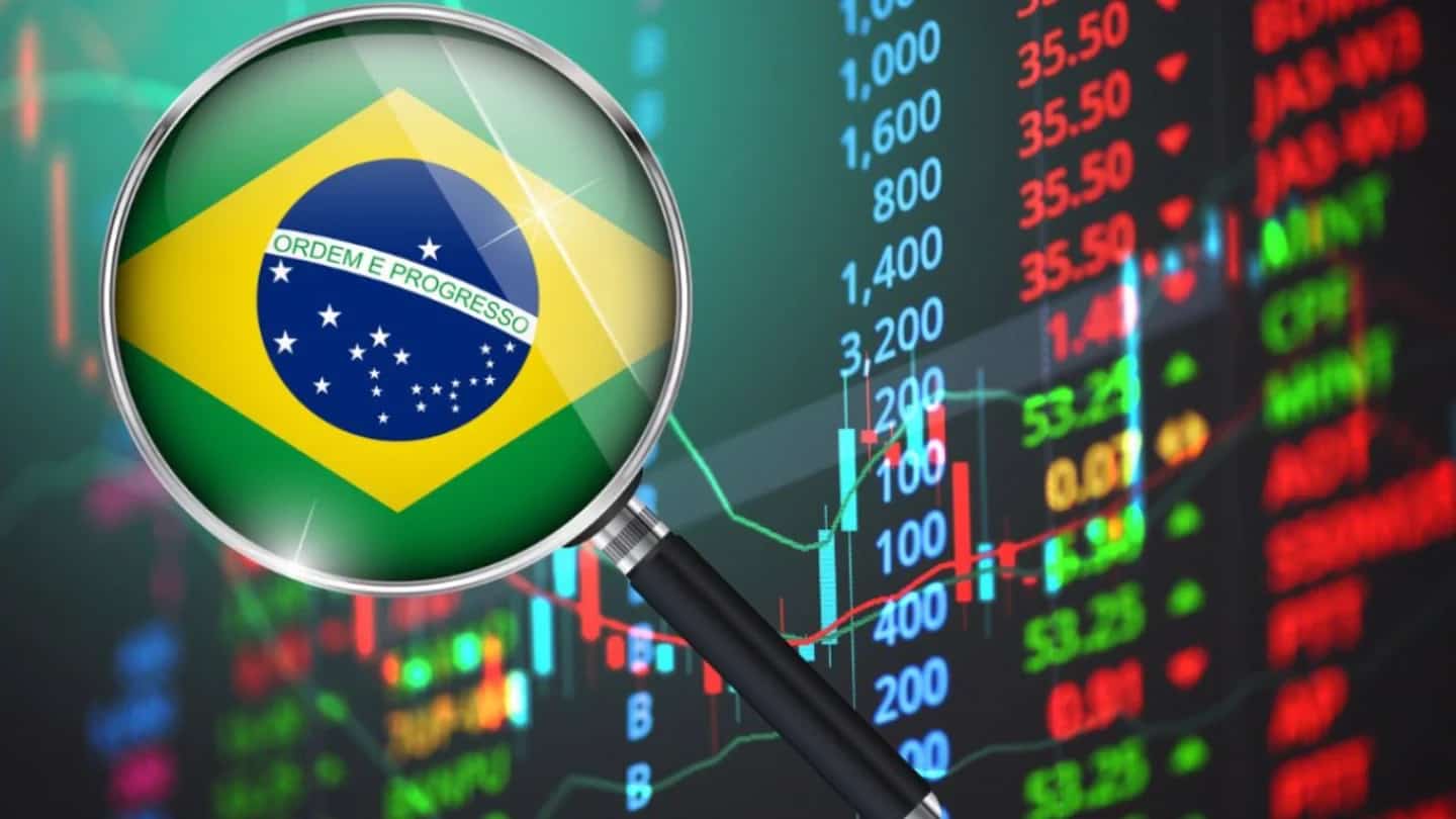 Gráfico de mercado em queda sobre a bandeira do Brasil